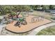 A vibrant playground, featuring swings, slides, and climbing structures, all nestled under the shade of mature trees at 2216 Eagle Bluff Dr, Valrico, FL 33596