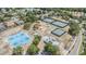 Aerial view of a recreational area featuring tennis courts, a basketball court, and playground for outdoor activities at 2216 Eagle Bluff Dr, Valrico, FL 33596