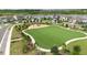 An aerial view of the community park featuring a playground for children at 2401 Morninglight Dr, Lutz, FL 33558