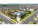 A Primary aerial view of the community clubhouse and amenity center with surrounding neighborhood at 2401 Morninglight Dr, Lutz, FL 33558