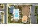 A top down aerial view of the community pool, splash pad, and playground area at 2401 Morninglight Dr, Lutz, FL 33558