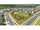 An aerial view showing community park, playground, and nearby residential homes at 2401 Morninglight Dr, Lutz, FL 33558