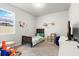 bedroom with a neutral color scheme, a twin bed, and -friendly decor at 2401 Morninglight Dr, Lutz, FL 33558