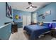 Blue bedroom featuring a bed, blue bedding, and decor for  at 2401 Morninglight Dr, Lutz, FL 33558