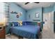 Blue bedroom featuring a bed, blue bedding, and decor for  at 2401 Morninglight Dr, Lutz, FL 33558