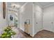 Well-lit entryway with wood-look flooring, modern decor, and views into the home at 2401 Morninglight Dr, Lutz, FL 33558
