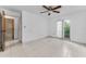 Spacious bedroom with tile flooring, ceiling fan, and natural light at 2700 Bayshore Blvd # 2110, Dunedin, FL 34698