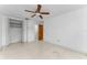 Tile floored bedroom with closet and access to ensuite bathroom at 2700 Bayshore Blvd # 2110, Dunedin, FL 34698