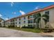 Beautiful building exterior with manicured landscaping and lovely balconies at 2700 Bayshore Blvd # 2110, Dunedin, FL 34698