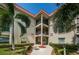 Stunning condo exterior with manicured grounds and grand entrance at 2700 Bayshore Blvd # 2110, Dunedin, FL 34698
