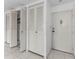Hallway with neutral paint with access to storage and unit entrance at 2700 Bayshore Blvd # 2110, Dunedin, FL 34698