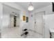 Hallway view with wood cabinets, laminate countertops and white appliances at 2700 Bayshore Blvd # 2110, Dunedin, FL 34698