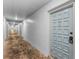 Condo hallway featuring neutral paint and doors leading to units at 2700 Bayshore Blvd # 2110, Dunedin, FL 34698