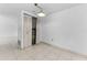 View of water heater inside closet in bright room with neutral tile flooring at 2700 Bayshore Blvd # 2110, Dunedin, FL 34698
