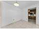 View of kitchen from neutral tile-floored room with white walls at 2700 Bayshore Blvd # 2110, Dunedin, FL 34698