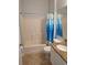 Bathroom featuring a shower and tub combination and granite countertops at 2713 Via Murano # 210, Clearwater, FL 33764