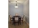 Dining room with modern chandelier and neutral tones at 2713 Via Murano # 210, Clearwater, FL 33764