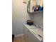 Functional laundry room with a washer, dryer, and storage shelves at 2713 Via Murano # 210, Clearwater, FL 33764