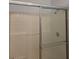 A neutral tiled shower with a glass door and chrome fixtures at 2713 Via Murano # 210, Clearwater, FL 33764