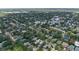 Expansive aerial view of a neighborhood showcasing lush trees, varied rooftops, and a charming residential community at 3011 Harbor View, Tampa, FL 33611