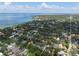 Beautiful aerial view of houses among lush trees near the coast, offering stunning views of the water and surrounding scenery at 3011 Harbor View, Tampa, FL 33611