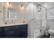 Modern bathroom featuring a glass-enclosed shower, vanity, and decorative mirror at 3011 Harbor View, Tampa, FL 33611