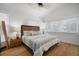 Serene bedroom with wood accents, hardwood floors, and ample natural light from large windows at 3011 Harbor View, Tampa, FL 33611