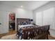 Bright bedroom with a wooden bed frame, an open closet, and wood floors at 3011 Harbor View, Tampa, FL 33611