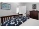 Bedroom with a wooden bed frame and a view into an adjacent room at 3011 Harbor View, Tampa, FL 33611
