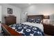 Bedroom featuring a dark wood bed frame, dresser, and nightstand with coordinated lamps at 3011 Harbor View, Tampa, FL 33611