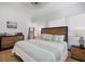 Bright bedroom featuring a queen bed with stylish wooden headboard and coastal decor at 3011 Harbor View, Tampa, FL 33611