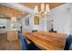Dining room featuring custom lighting, wood ceilings, and hardwood floors at 3011 Harbor View, Tampa, FL 33611