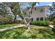 Beautifully landscaped front yard with a charming home and inviting walkway, perfect for outdoor enjoyment at 3011 Harbor View, Tampa, FL 33611