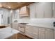 Gourmet kitchen with marble countertops, a chef's range, and ample cabinet space with elegant hardware at 3011 Harbor View, Tampa, FL 33611