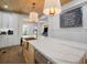 Open kitchen with marble countertops, stainless steel appliances, and wood accents at 3011 Harbor View, Tampa, FL 33611
