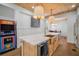 Gourmet kitchen with island, stainless steel appliances, and direct sight lines to the dining area at 3011 Harbor View, Tampa, FL 33611