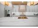 An airy kitchen with stone countertops, custom cabinets, and premium appliances for gourmet cooking at 3011 Harbor View, Tampa, FL 33611