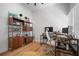 Spacious home office featuring a modern desk setup, shelving, and wood floors at 3011 Harbor View, Tampa, FL 33611