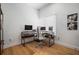 Bright home office with modern desk, ample workspace, natural light, and wood floors at 3011 Harbor View, Tampa, FL 33611
