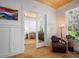 Bright home office featuring wood floors, white walls, and direct access to the main living space at 3011 Harbor View, Tampa, FL 33611