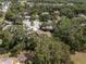 Expansive aerial view of a residential neighborhood with mature trees and well-maintained lawns at 3205 Coventry N, Safety Harbor, FL 34695