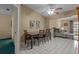 Open dining room with tile flooring, view into living room and outdoor access at 3205 Coventry N, Safety Harbor, FL 34695