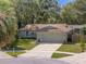 Exterior aerial view of a well-maintained home with a spacious driveway at 3205 Coventry N, Safety Harbor, FL 34695