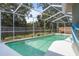 Backyard pool featuring clear water and a screened enclosure at 3205 Coventry N, Safety Harbor, FL 34695
