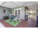 Outdoor patio with table seating, view of patio and landscaping at 3205 Coventry N, Safety Harbor, FL 34695