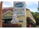The exterior of Paradise Restaurant, featuring a sign, statuary, and an inviting facade at 3205 Coventry N, Safety Harbor, FL 34695