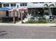 Cozy outdoor patio with decorative lights and gift box display, surrounded by brick-paved streets at 3205 Coventry N, Safety Harbor, FL 34695
