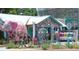 Whimsical storefront with colorful decor, a pink elephant, and eclectic art installations at 3205 Coventry N, Safety Harbor, FL 34695