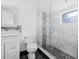 Modern bathroom featuring a glass enclosed shower with black and white tiles and a vanity at 3310 W Ballast Point Blvd, Tampa, FL 33611