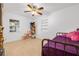 Bedroom featuring tile floors, a twin bed, and a window with backyard view at 3310 W Ballast Point Blvd, Tampa, FL 33611
